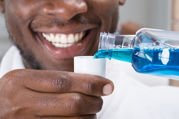 man with mouthwash