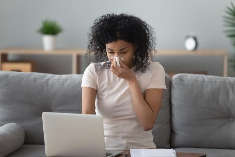 woman sneezing