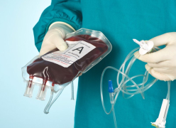 Surgeon holding a blood transfusion bag